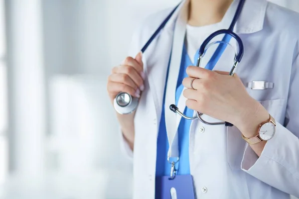 depositphotos_283360058-stock-photo-woman-doctor-standing-with-stethoscope (1)